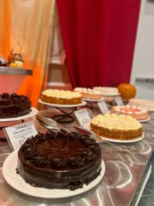 The dessert table at our Thanksgiving buffet features an incredible assortment of cakes, pies, pastries, and other sweet treats. 