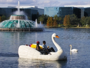 A couple enjoys a swan boat ride at Lake Eola for National Girlfriend Day.